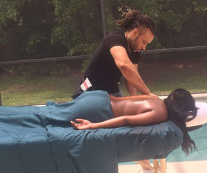 Donnell Massaging Beside a Pool